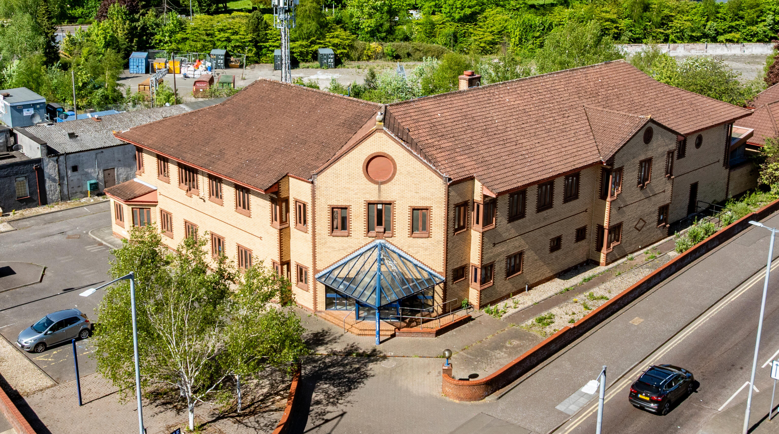 Drone view of Locked Self Storage Alloa at 6 Mar Place, showing the converted former police station and secure yard.