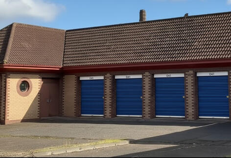 Drive-up Garage Vaults at Locked Self Storage Alloa, featuring reinforced brick walls, power, and lighting for trades and business storage.