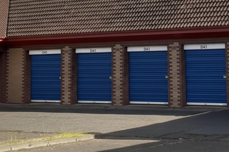 Drive-up Garage Vaults at Locked Self Storage Alloa, featuring reinforced brick walls, power, and lighting for trades and business storage.